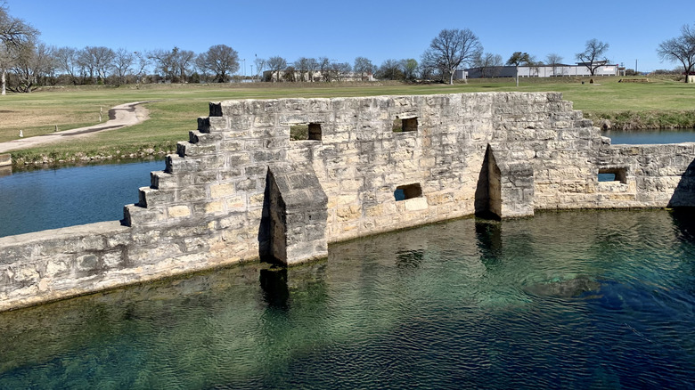 Historic dam inside swimming hole at Hancock Springs in Lampasas, Texas