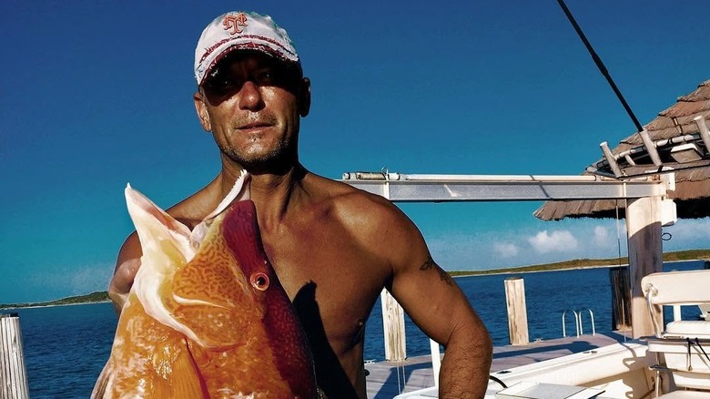 Tim Mcgraw with a catch in the Exumas