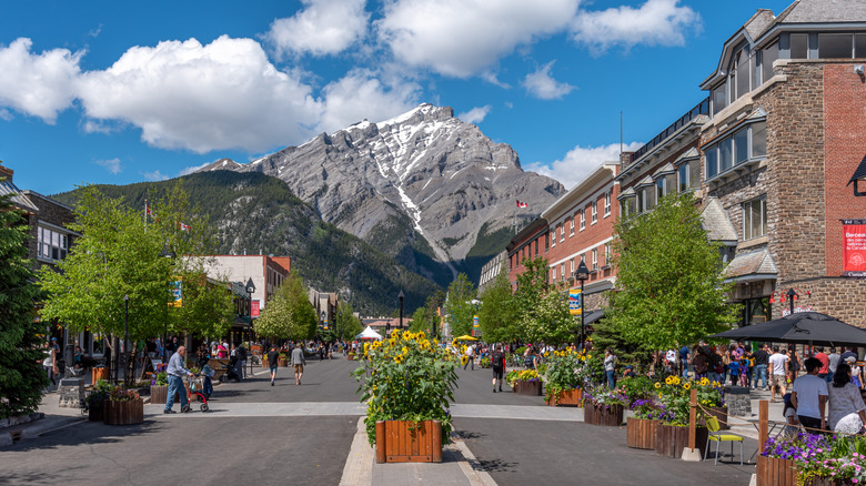 A dramatic mountain view from Banff Avenue in downtown Banff, Alberta, Canada in Banff National Park