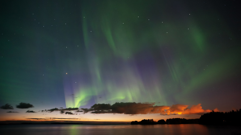 The northern lights and stars shine over Great Bear Lake, NWT.