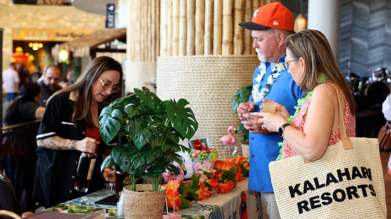 Guests enjoy a special wine and dine event in the check-in area of the Kalahari Resort in Round Rock, Texas