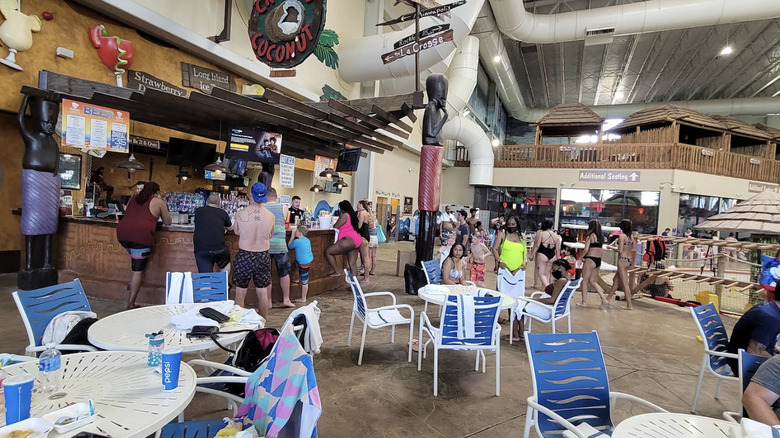 Crowd of people milling around a bar area at the indoor waterpark at Kalahari Resort in the Wisconsin Dells