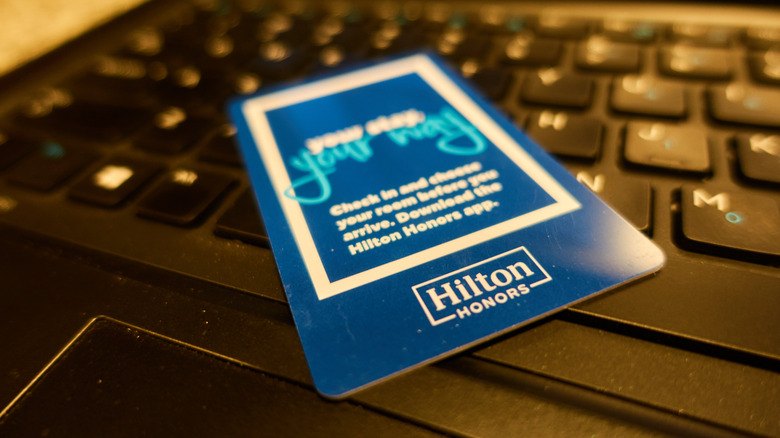Close up of Hilton hotel key laying on computer keyboard