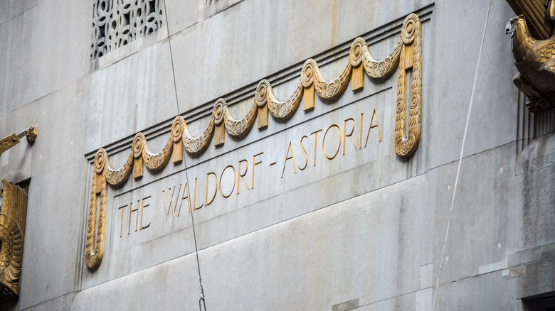 Close up detail of the Waldorf-Astoria name in gilded letters