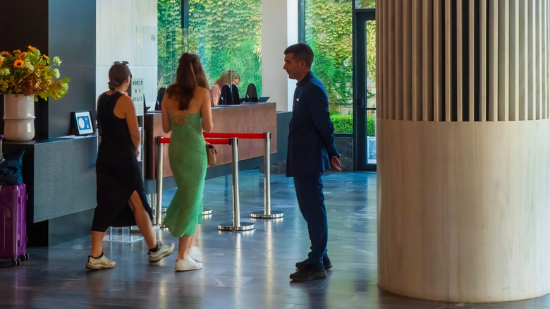 Porter waiting to assist guests checking in at the Grand Hyatt Hotel Athens in Greece