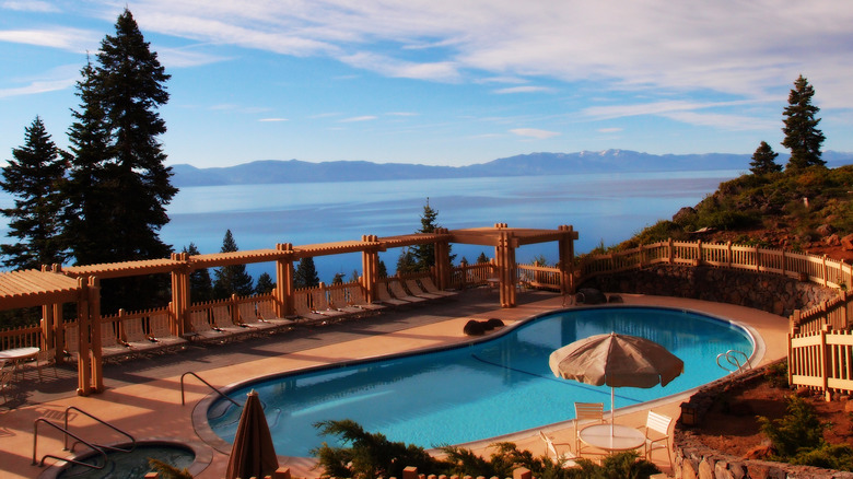 View of a luxurious pool at a ski lodge overlooking Lake Tahoe