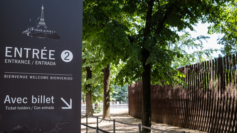 Signage directing ticket holders is seen near the Eiffel Tower in Paris France