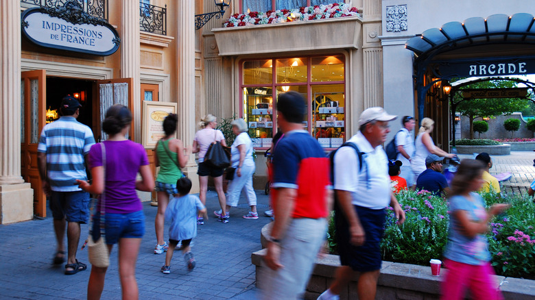 Epcot crowds walking through the France pavilion