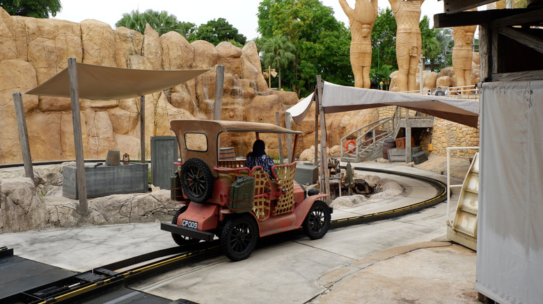 Vintage car ride vehicle at Universal Singapore travels through an Egyptian-themed attraction