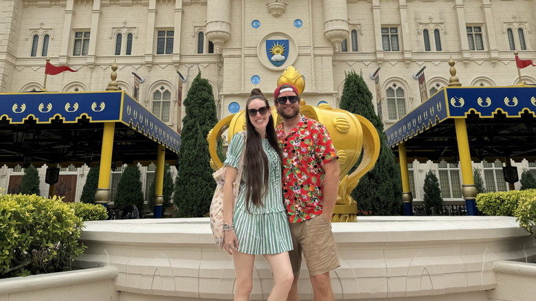 Couple posing outside of the Far Far Away castle at Universal Studios Singapore