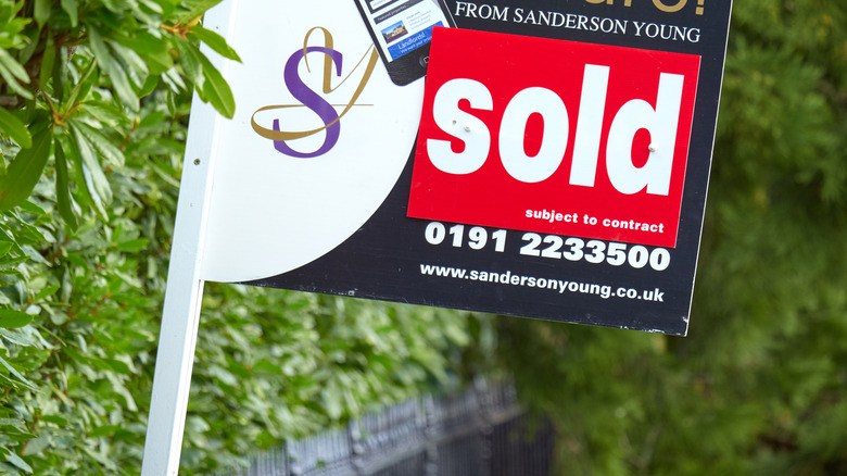 A real estate agent's sold sign