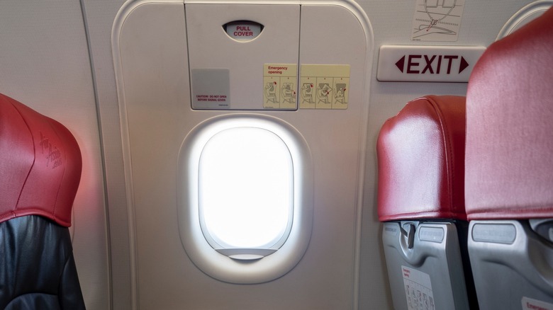 Airline emergency exit seats with a window in the middle