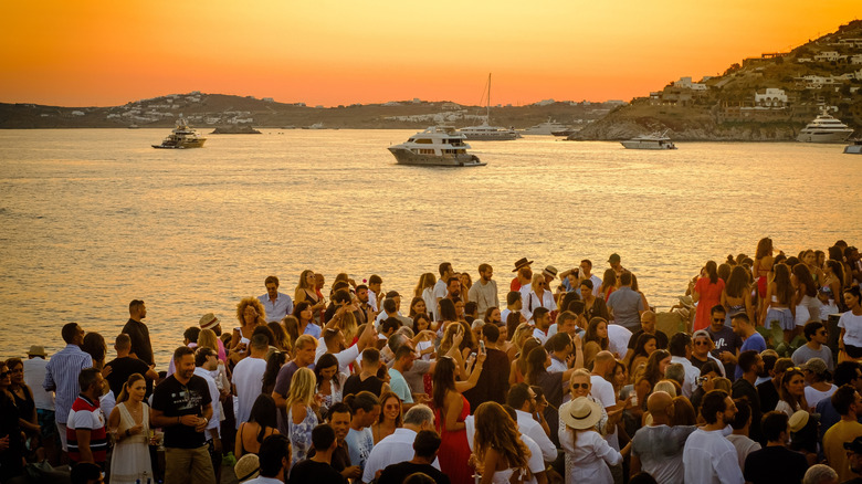 crowded party beach in mykonos