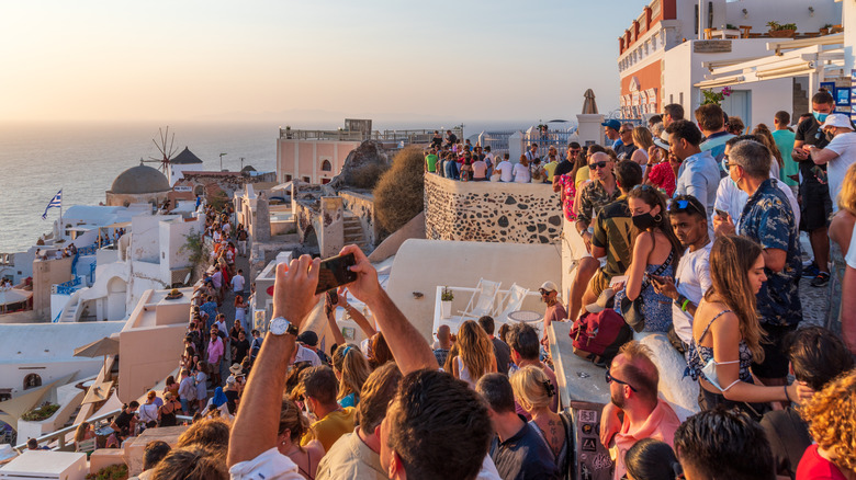 Large crowds in Santorini at sunset