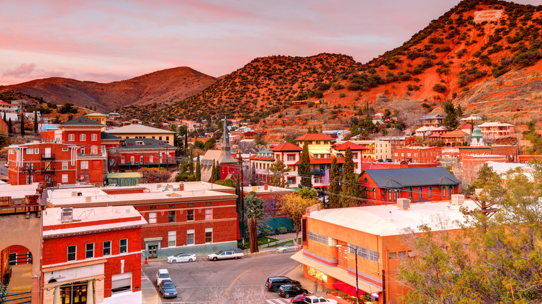 Overhead view of downtown Bisbee, Arizona at dusk with historic buildings converted into modern businesses, galleries, and more