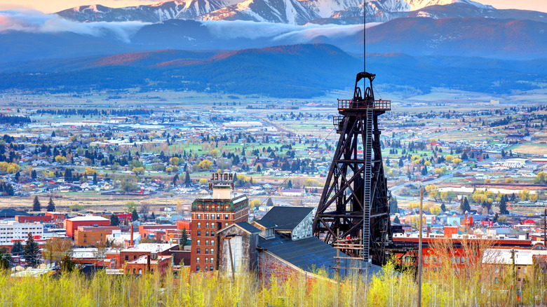 View of an abandoned mining structure in the foreground with the town of Butte, Montana below