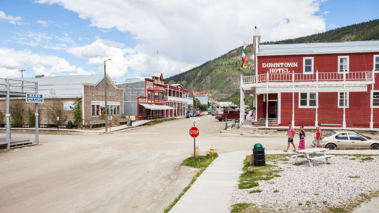Image of people walking along a downtown street in the preserved mining town of Dawson City, Yukon, Canada