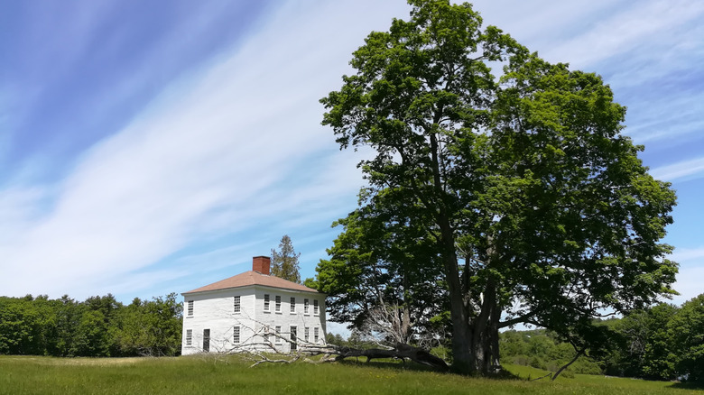 Abandoned white house from Perkins ghost town on Swan Island, Maine