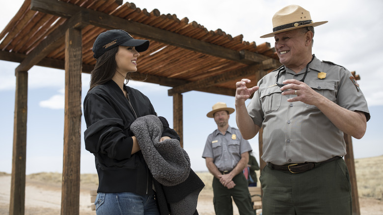 View of a woman seeking advice from park rangers at Petroglyph National Monument.