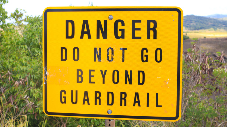 Warning sign near Waimea Canyon in the Hawaiian island of Kaua'i, Hawaii,