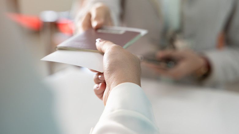 A woman participating in a passport check.