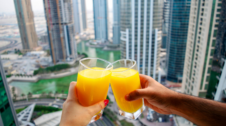 A couple drinking orange juice in Dubai