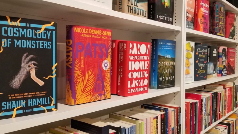 A wall of colorful bookshelves at Greedy Reads Remington in Baltimore.