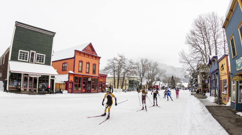 Skiers racing through Elk Avenue, Crested Butte's main street