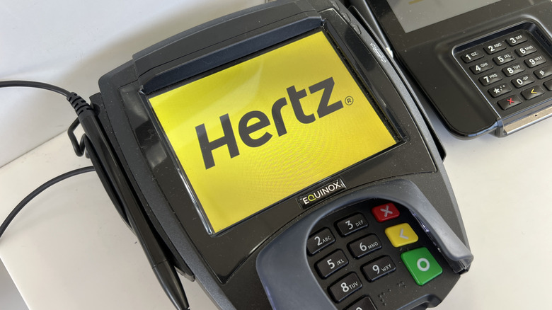 Logo for car rental company Hertz on a credit card terminal