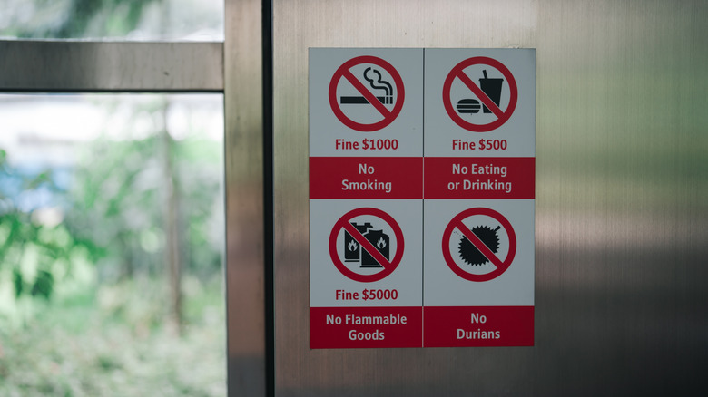 Forbidden items in Singapore MRT subway stations and trains with associated fines. No durians, no food and drink, no smoking