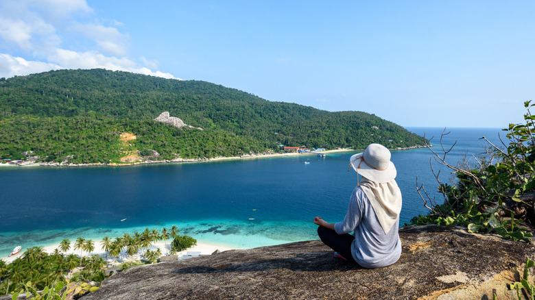 Woman admiring view on Pulau Aur in Malaysia