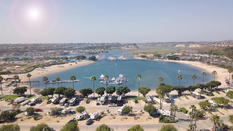 Aerial view of Newport Dunes Resort lagoon, beach, and RV campsites.