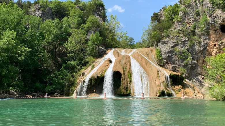 Turner Falls and a turquoise swimming hole in Turner Falls Park, Oklahoma