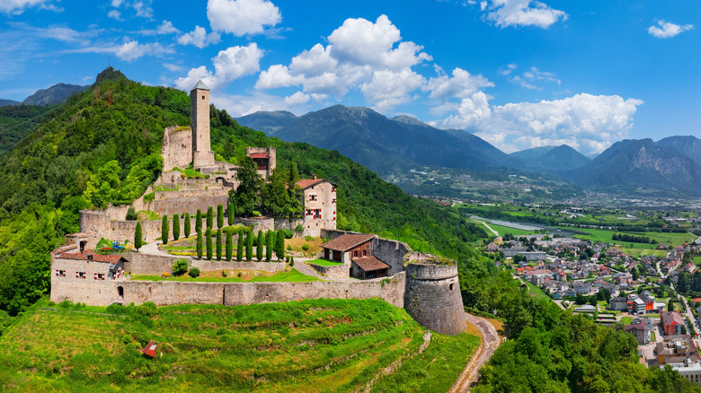An abandoned castle in Trentino against the mountains
