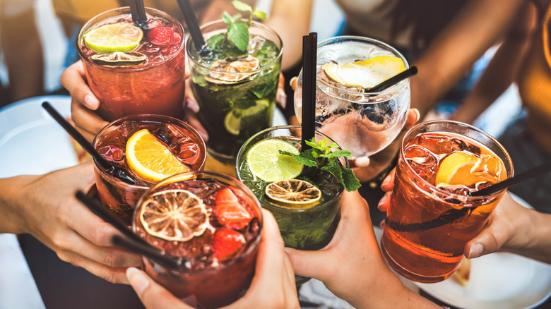 Friends toasting cocktails