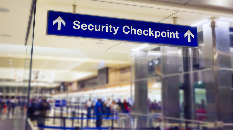 A security checkpoint sign in an airport