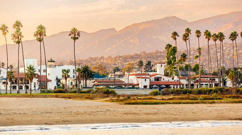 View from the ocean of Santa Barbara beach with iconic white walled, red-tiled roof buildings