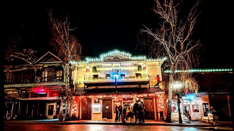 Nighttime holiday season view of the front of the Crazy Horse Saloon & Grill