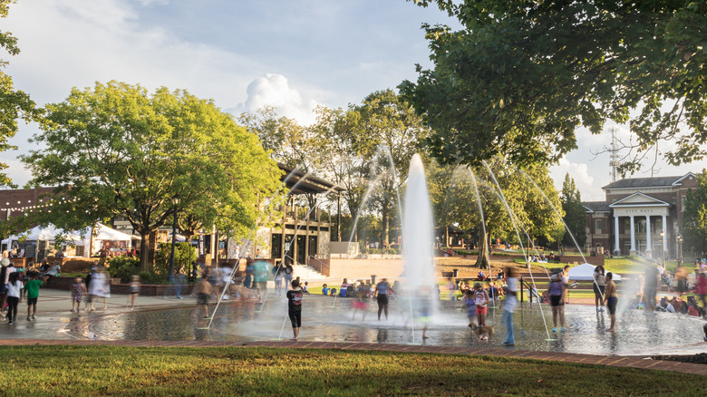Families enjoy splash park and fountain in downtown Duluth