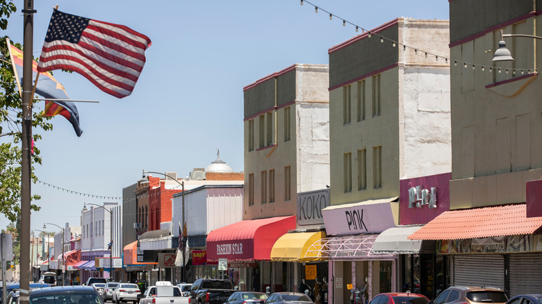 A row of shops in Nogales, Arizona and an American Flag