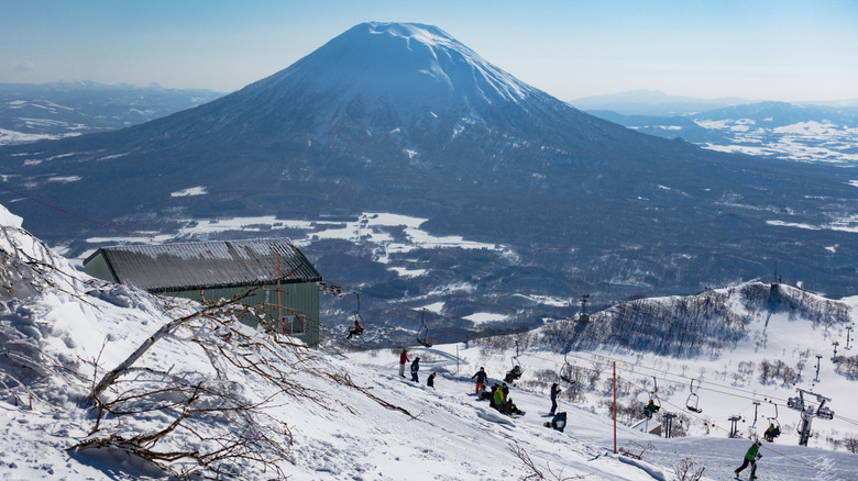Skiers at the Peak of Mount Annupuri, part of the Niseko United, Japan