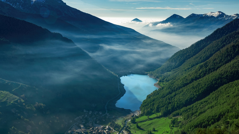 Blue lake in valley surrounded by mountains