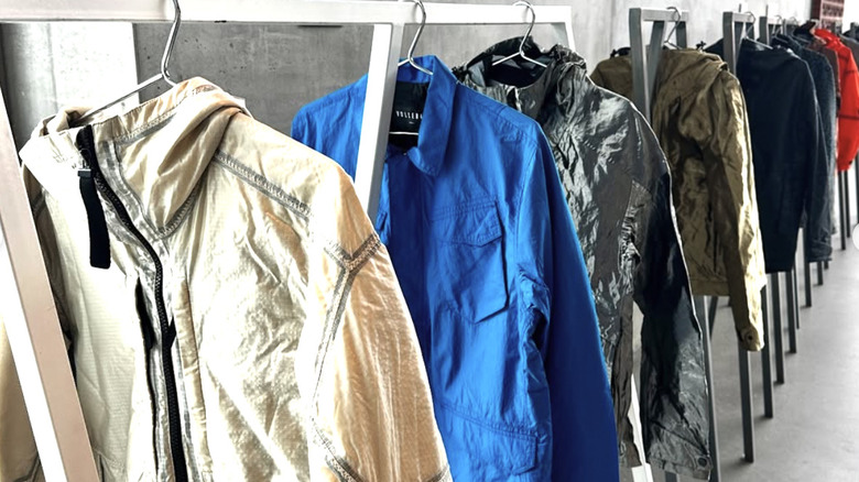 Vollebak jackets hanging on a clothing rack