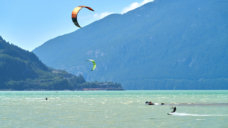 Man kiteboarding among mountains of Howe Sound