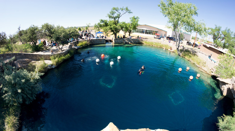 Scuba divers in Santa Rosa Blue Hole