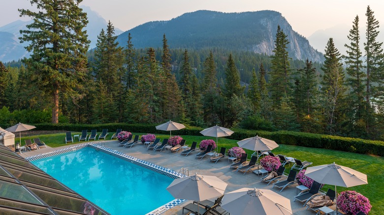 Hotel pool in Banff Canada with mountains in background