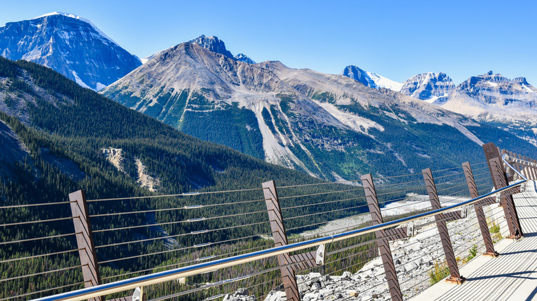 Railings on a platform with mountain views