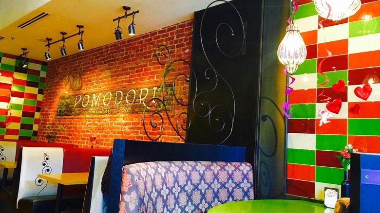 Booths and colorful decorations at Marco's Coal Fired in Denver