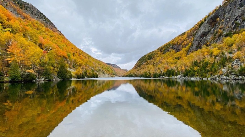 Upper Cascade Lake and surrounding cliffs in autumn
