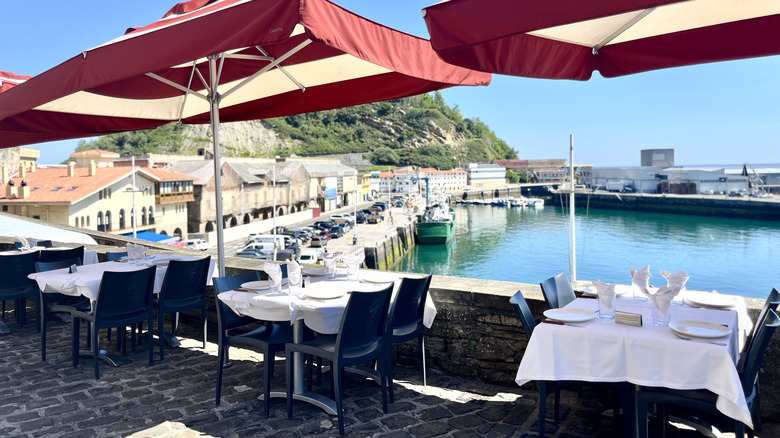 terrace seating at a restaurant overlooking the port in Getaria